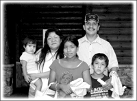Rice planting guide Don Chosa with his family Keweenaw Bay Indian Community (KBIC)